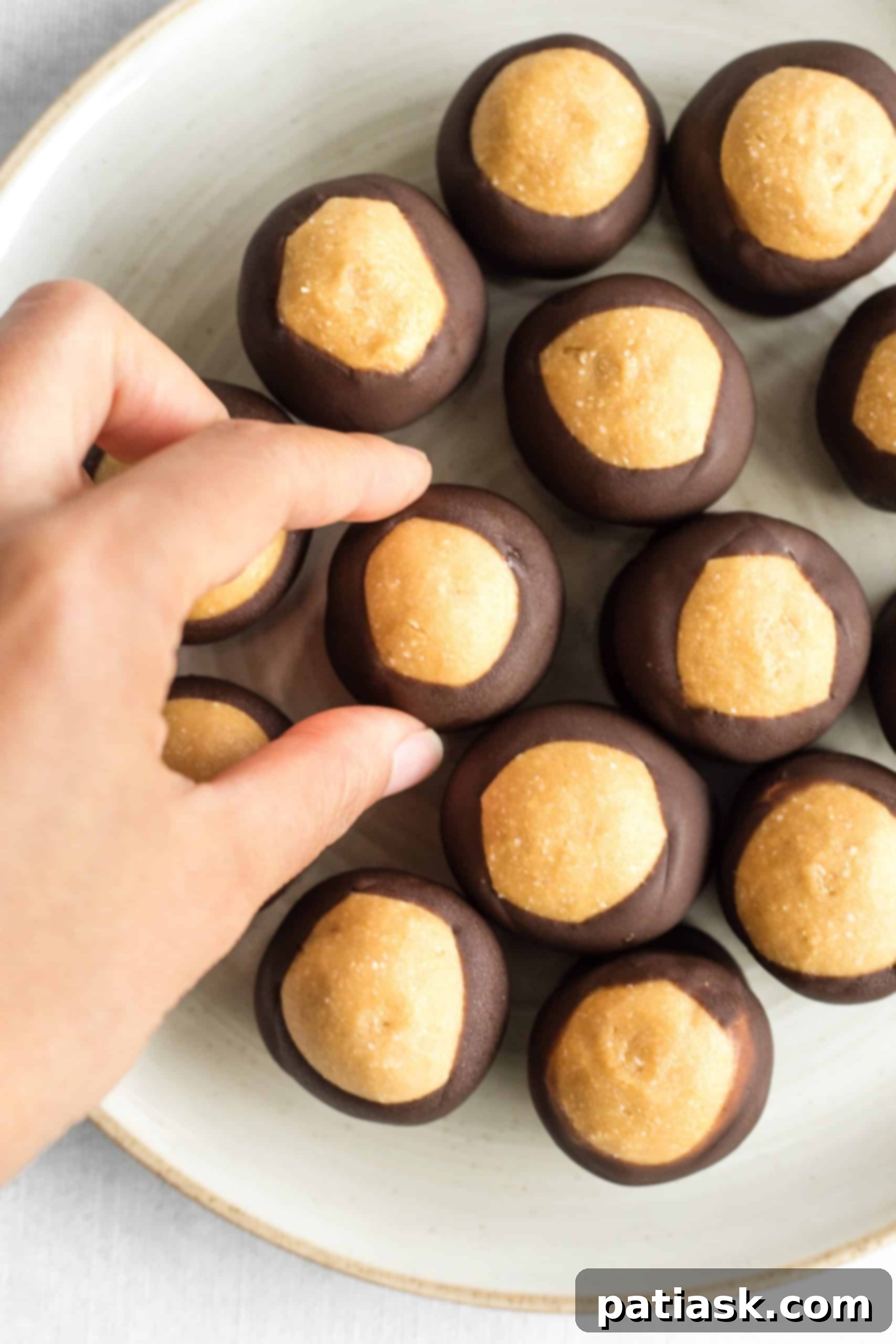 Gluten-Free and Vegan Peanut Butter Buckeye Balls, coated in chocolate