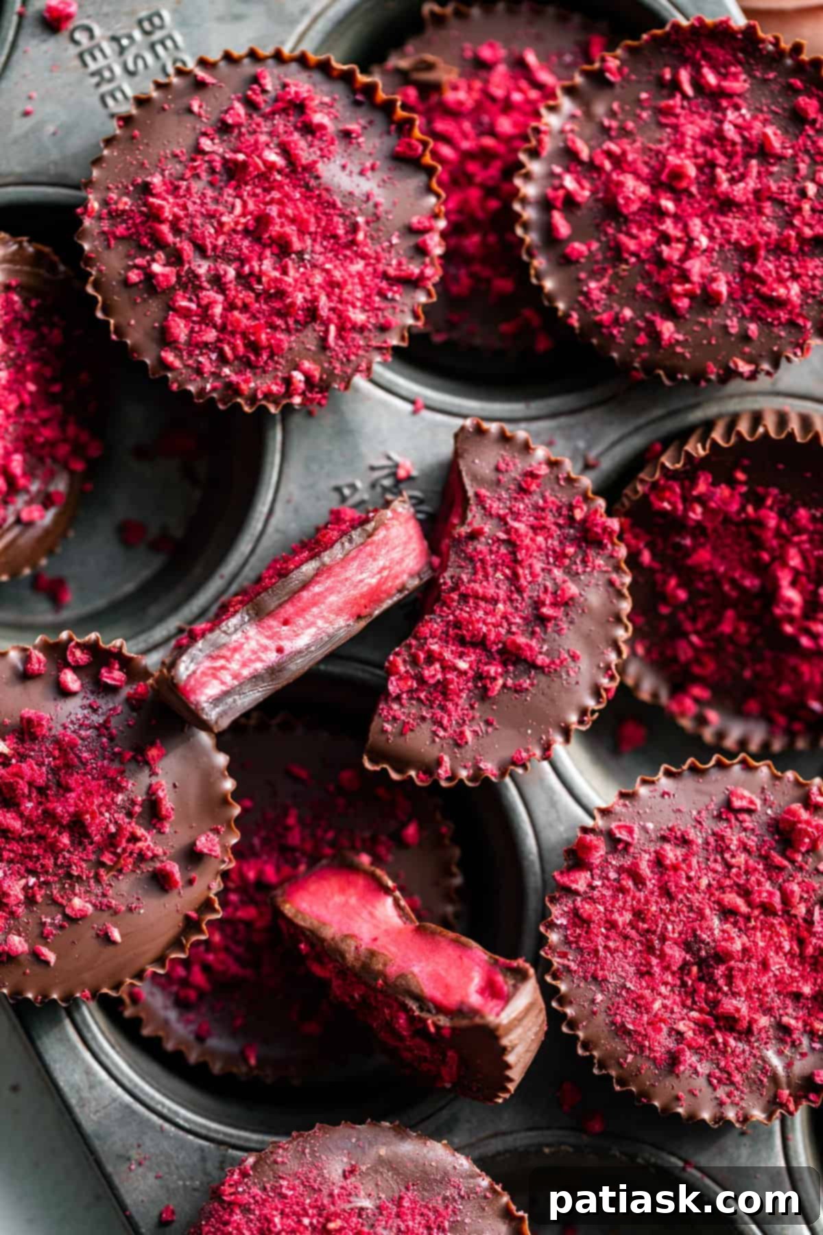 Healthy and decadent Raspberry Chocolates with freeze-dried raspberries on top