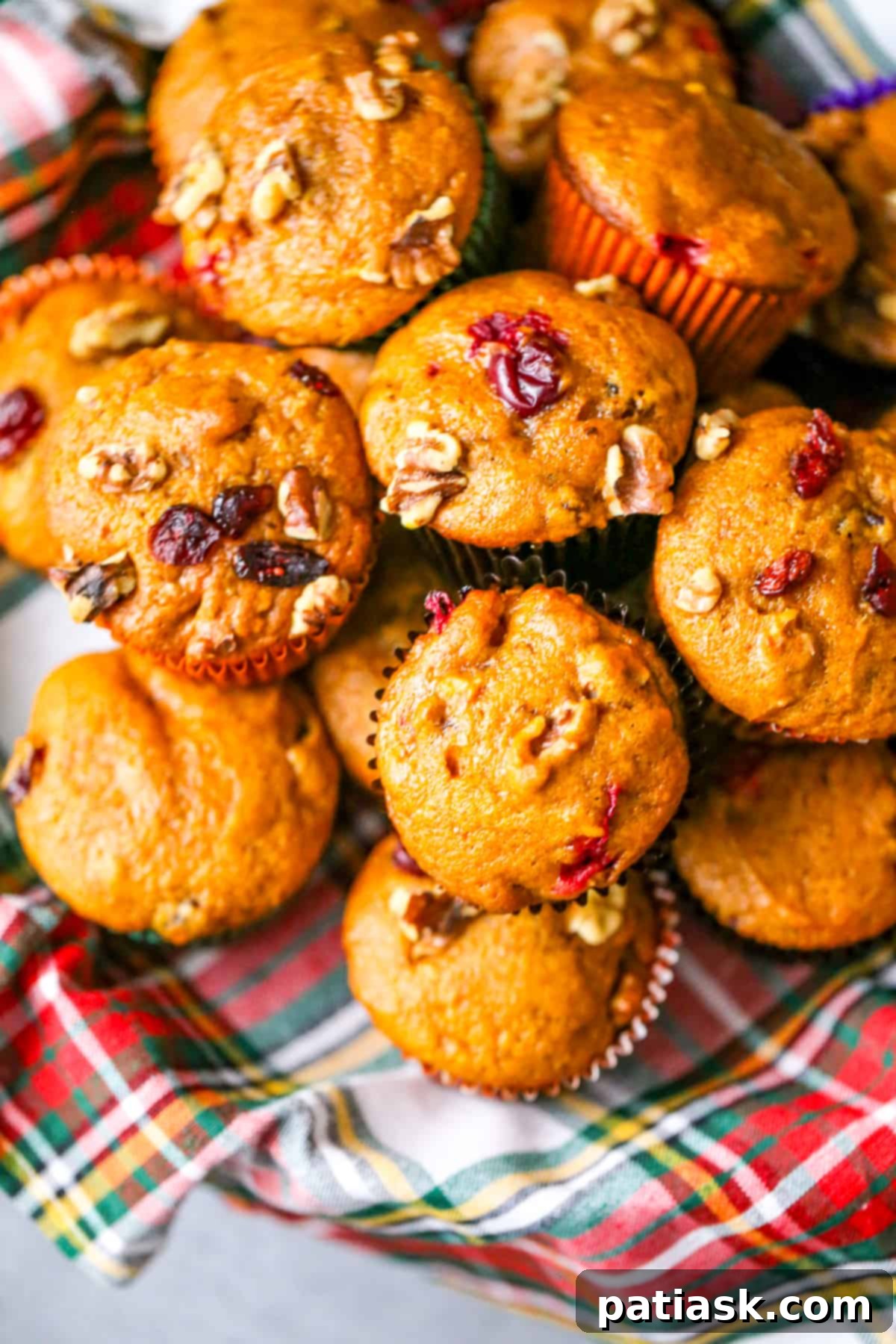Secrets to Baking Perfect Muffins Every Time 3 Best Pumpkin Cranberry Muffins Essential Tips for Perfect Muffin Baking! A close-up of beautifully baked pumpkin cranberry muffins.
