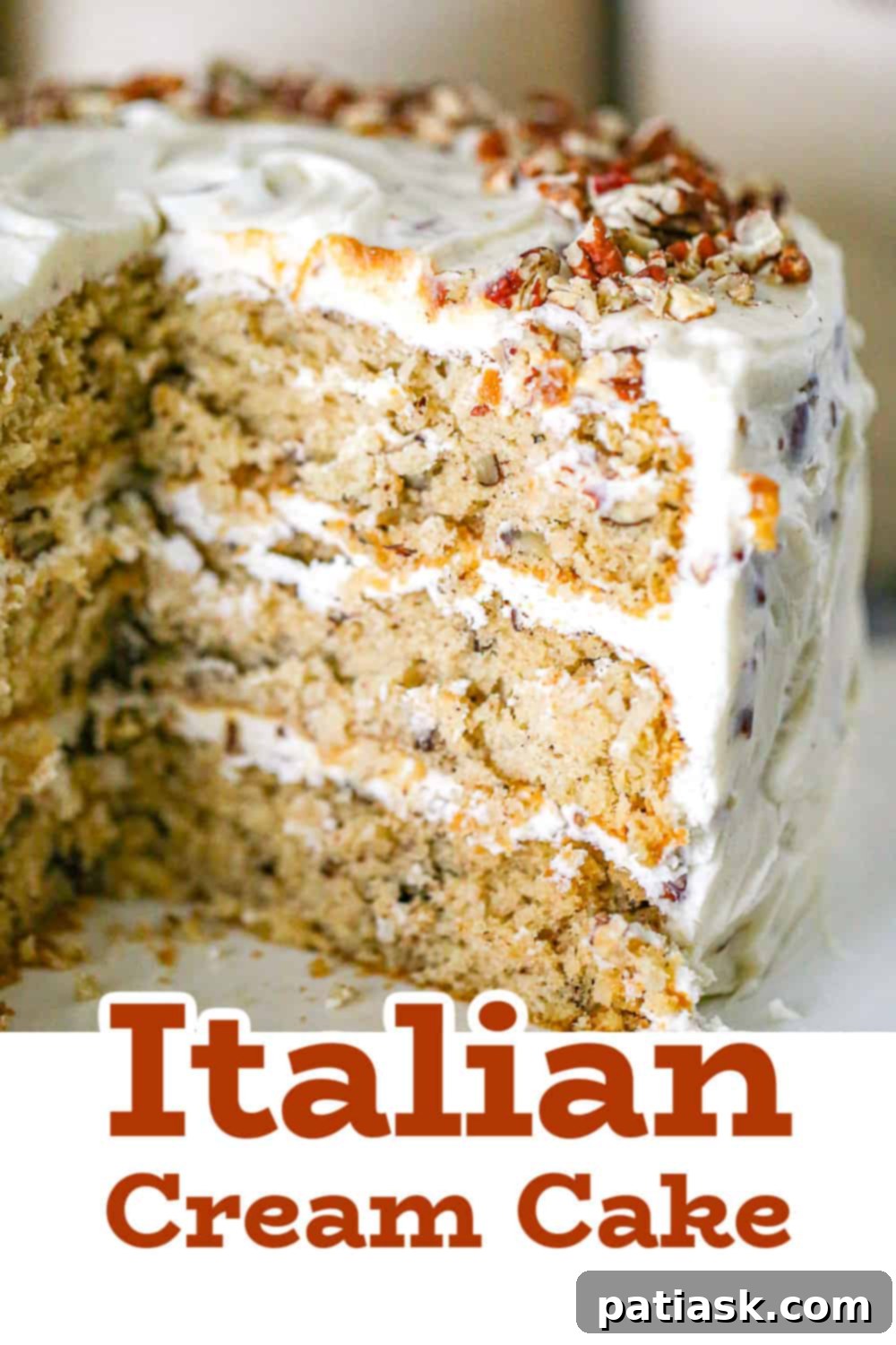 Close-up of the delicate crumb and rich frosting of the Italian Cream Cake.