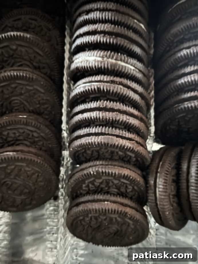 Foolproof and Fabulous Oreo Pie Crust 3 cookies in a tray with filling