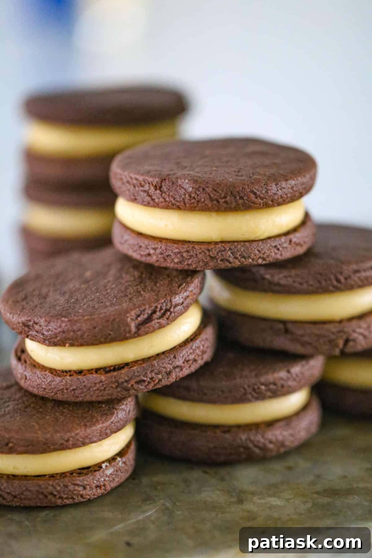 Butterscotch Chocolate Sandwich Cookies 2 Homemade butterscotch filling chocolate sandwich cookies recipe on a white plate