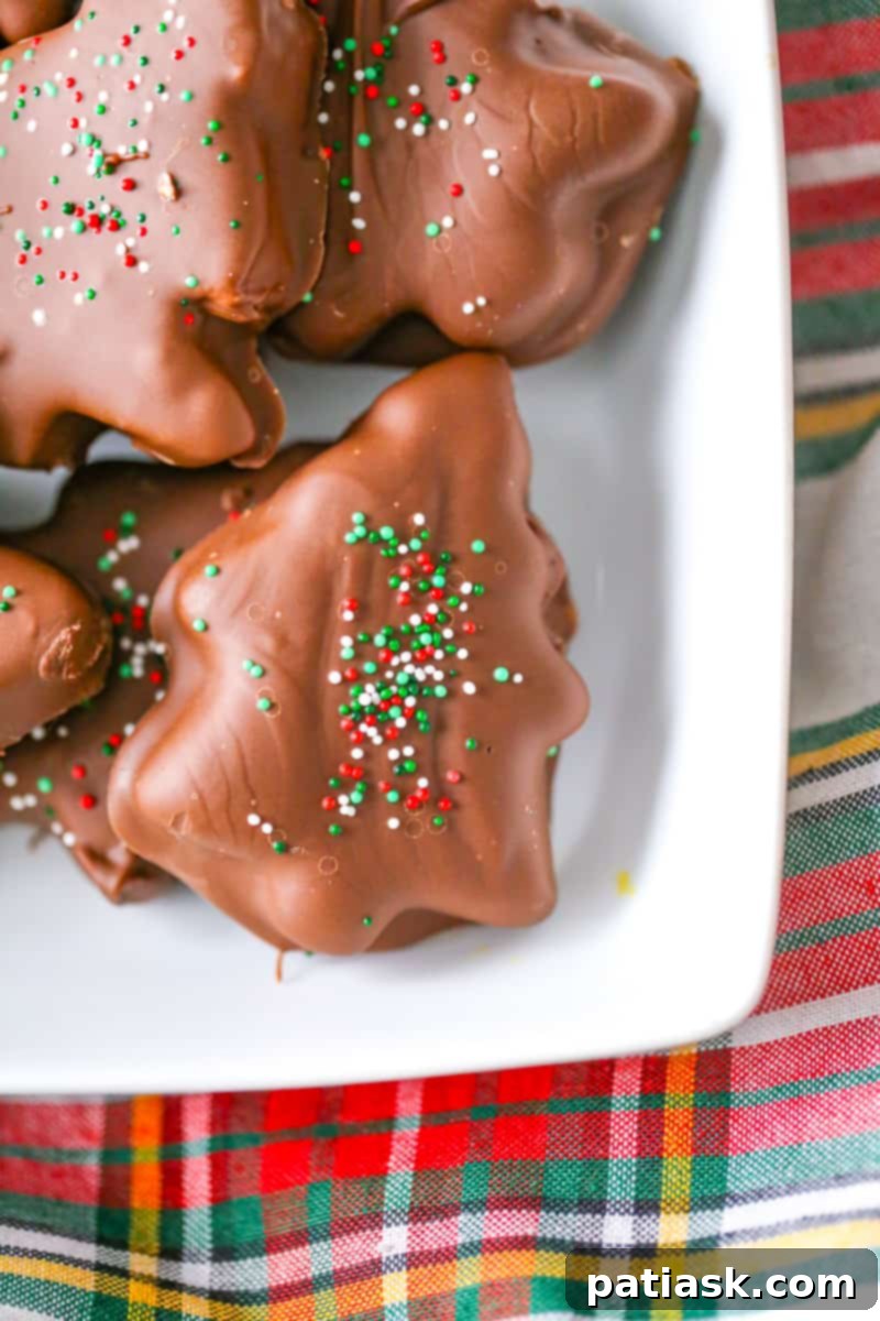 Festive Peanut Butter Chocolate Trees 7 Beautifully decorated Chocolate Peanut Butter Christmas Trees on a platter