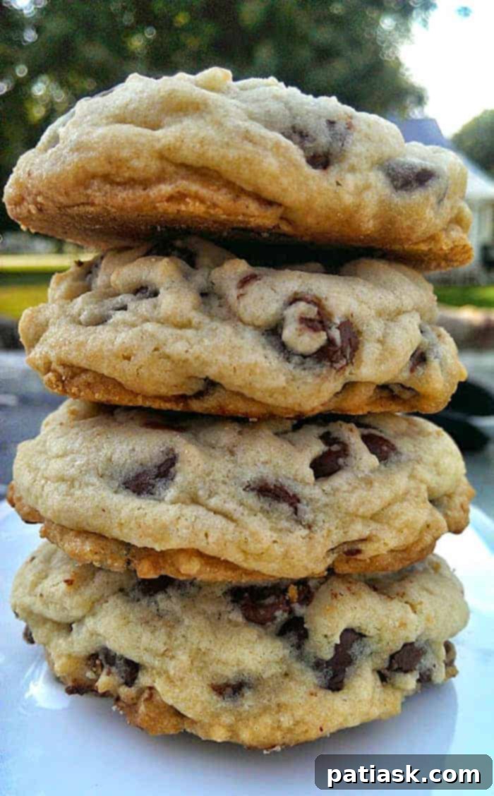 65 Festive Christmas Cookie Creations 22 Stack of Soft Batch Chocolate Chip Cookies, showcasing their gooey centers