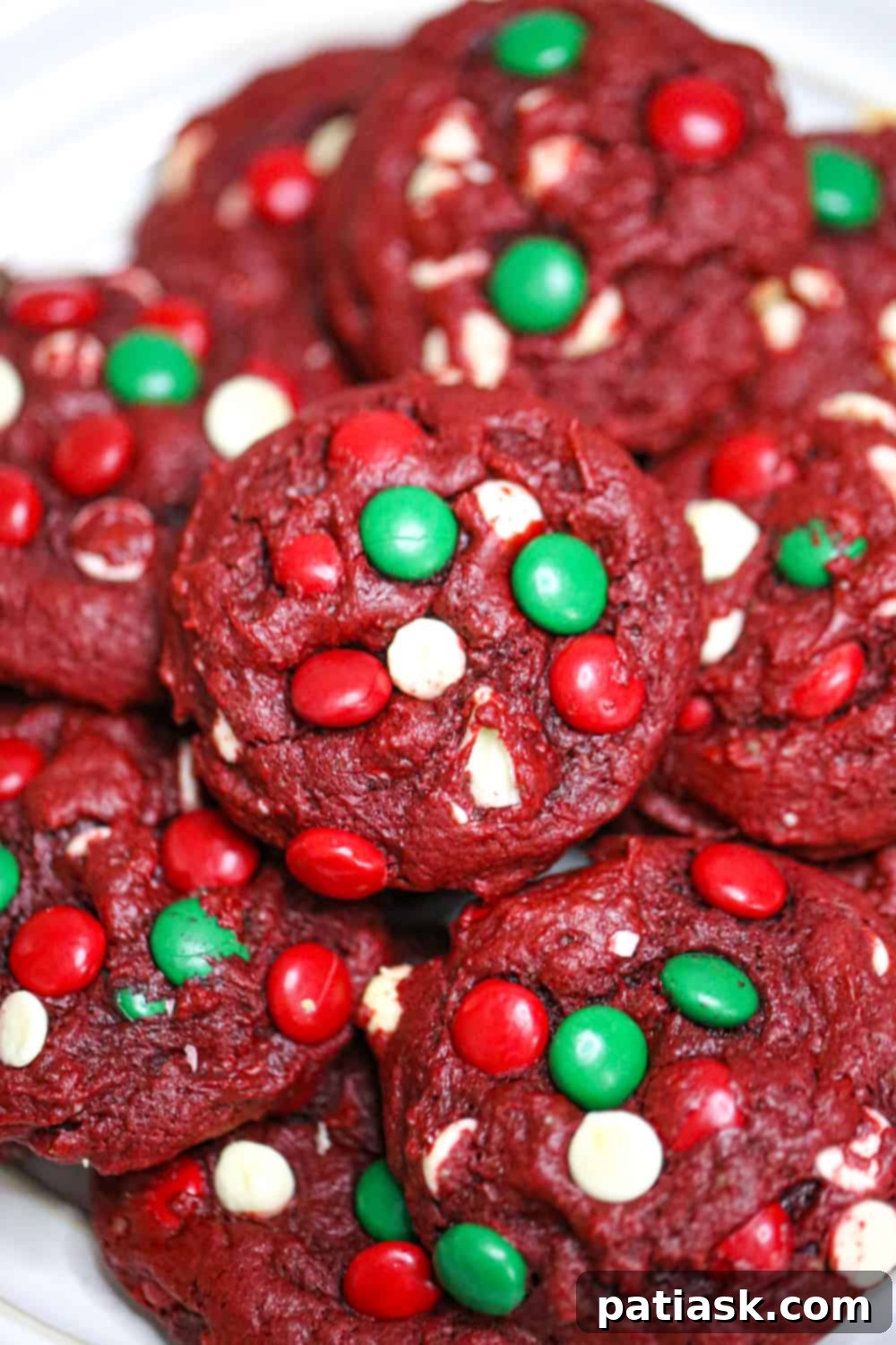 65 Festive Christmas Cookie Creations 24 Santa's Red Velvet Cookies with a white frosting swirl