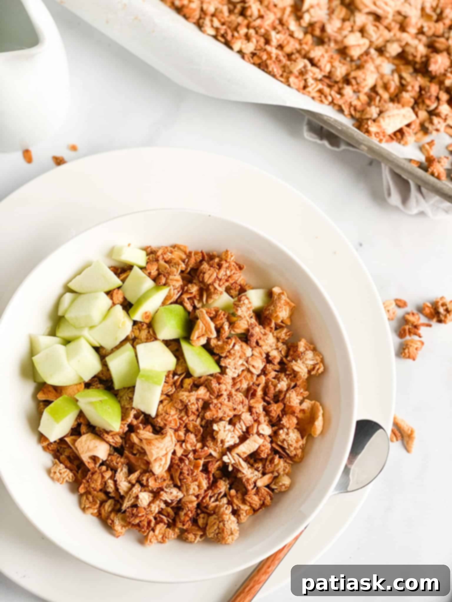 Cinnamon apple granola with wholesome oats and fruit pieces.