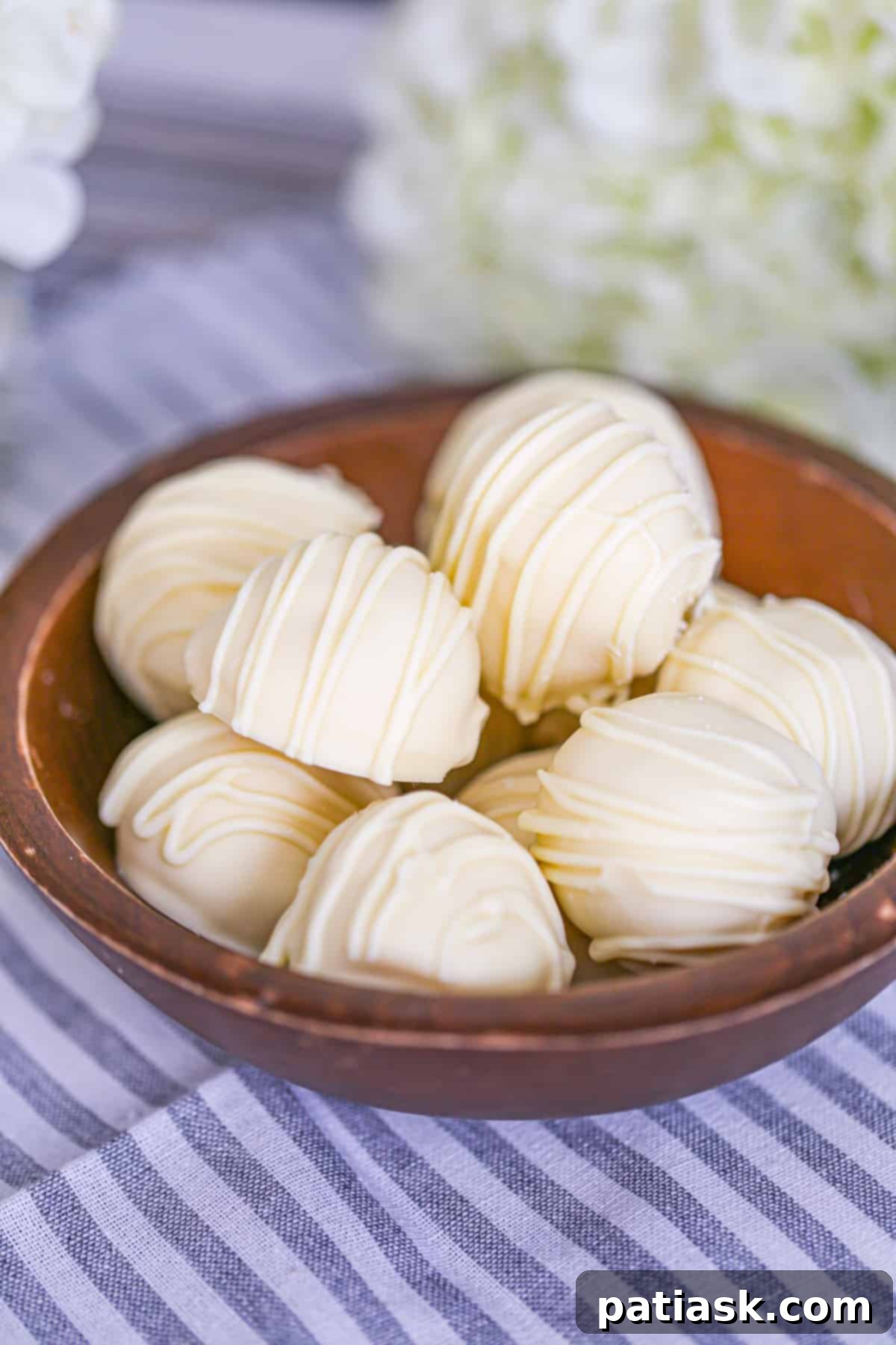 Velvet White Truffle Bliss 7 no bake truffles white chocolate recipe - a plate of white chocolate truffles ready to serve