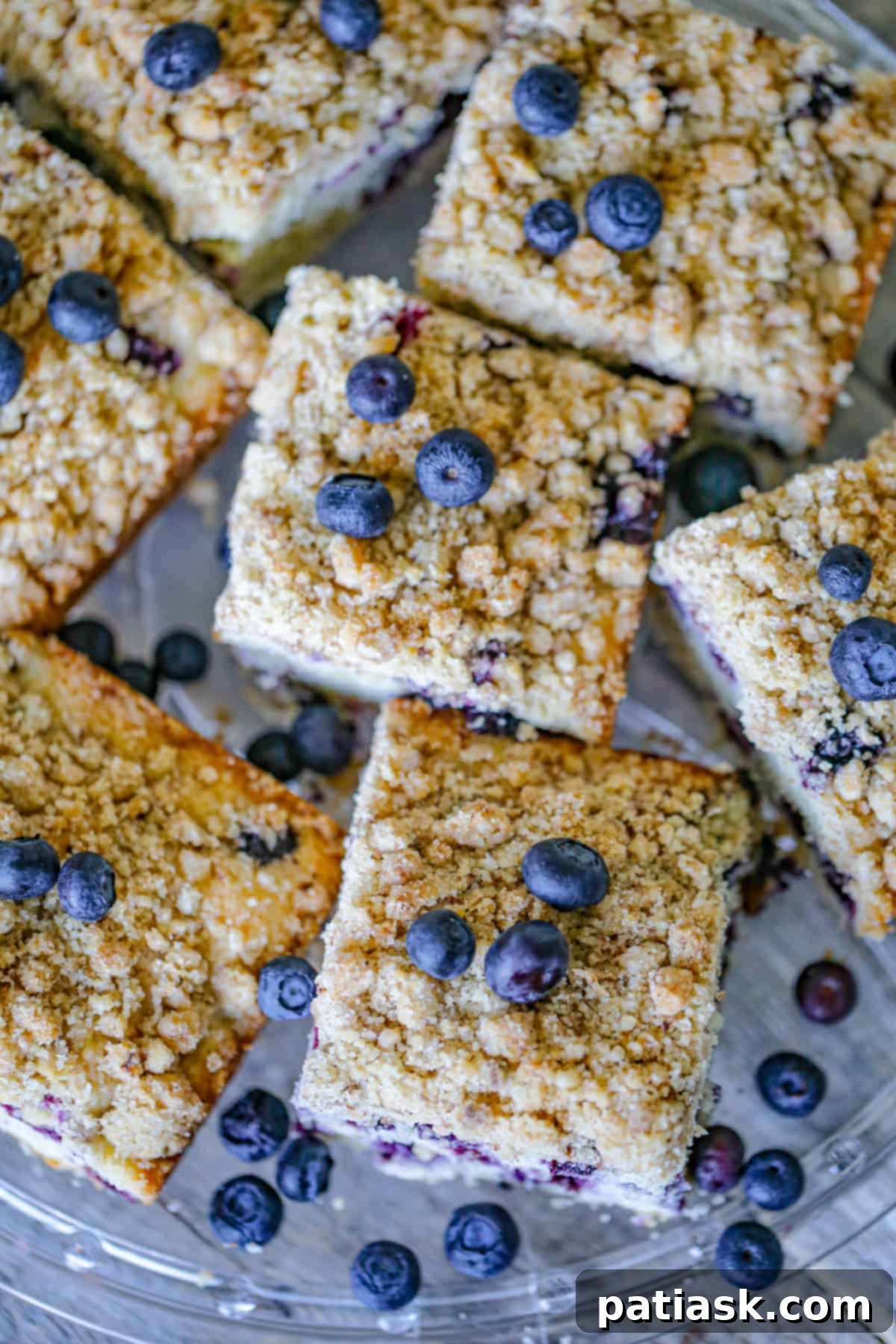 Close-up of baked Blueberry Crumble Coffee Cake showing golden topping and berries