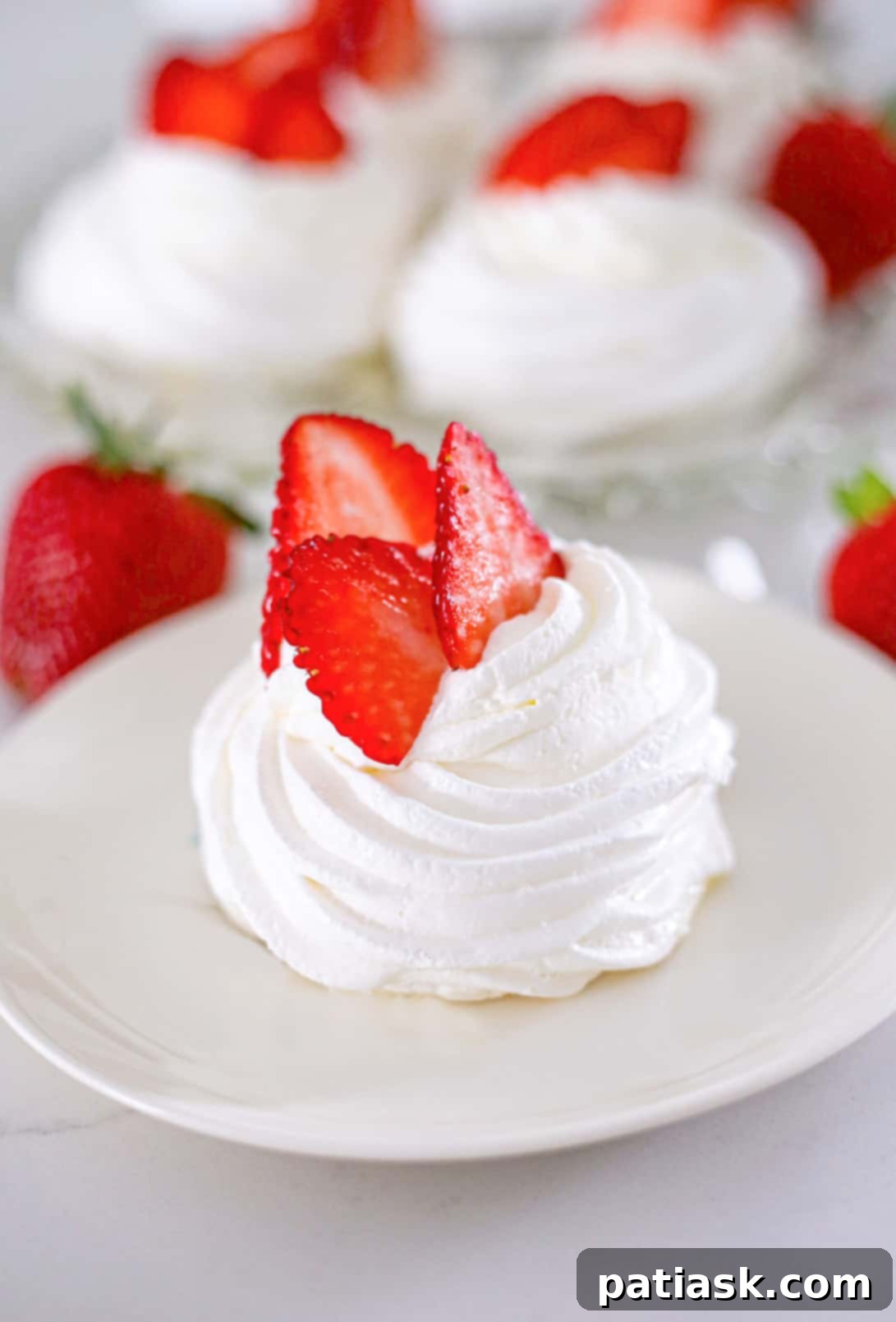 Foolproof Pavlova 7 Various mini Pavlova desserts with different fruit toppings