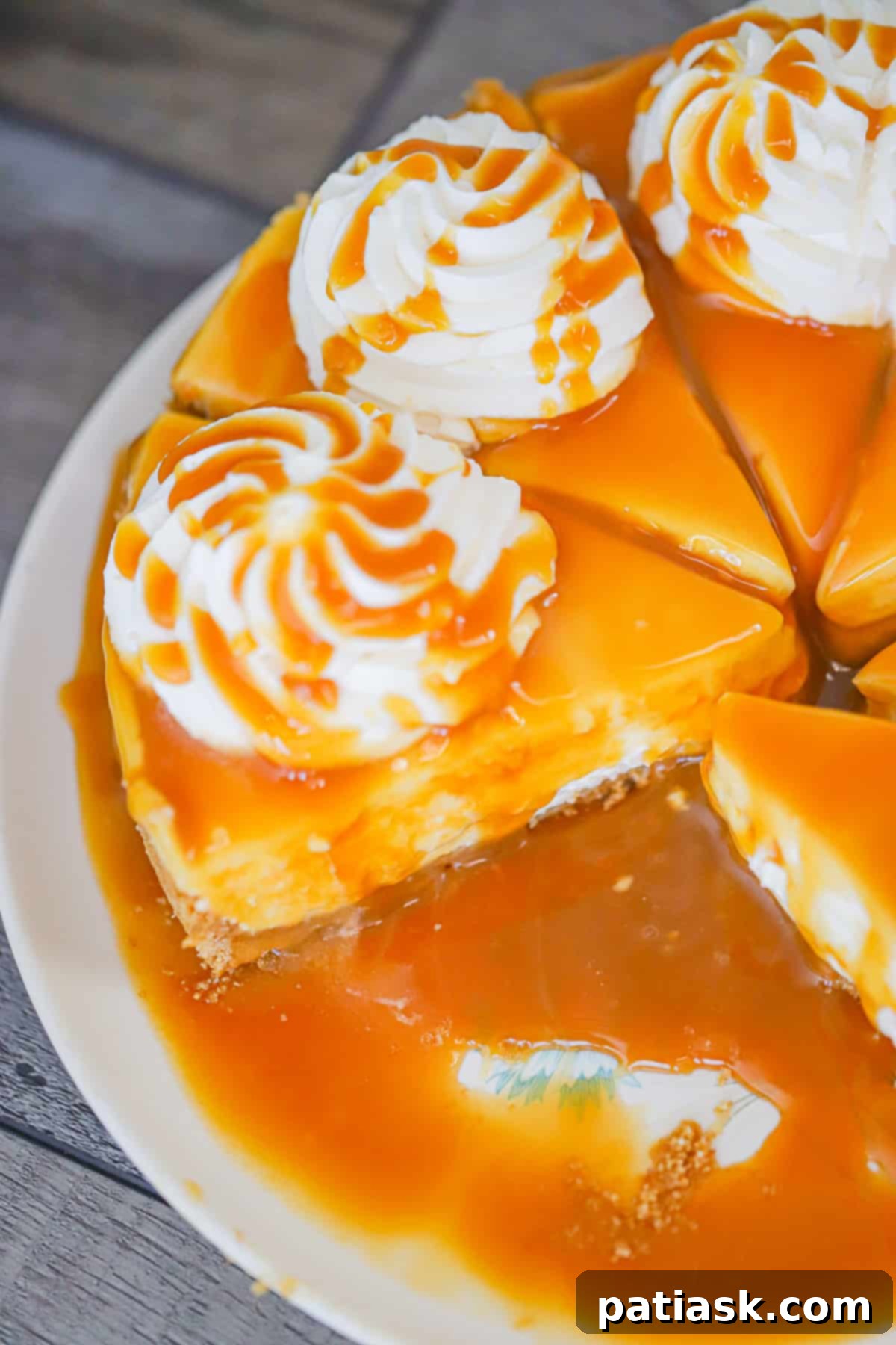 Effortless No-Bake Salted Caramel Cheesecake 7 A slice of creamy no bake salted caramel cheesecake on a plate