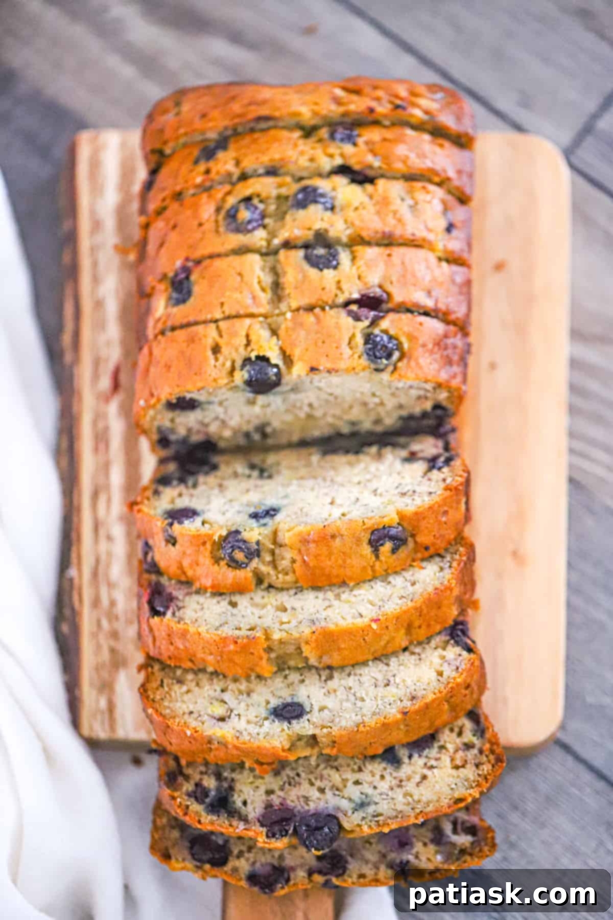 Effortless Blueberry Banana Bread 8 Slices of easy and moist blueberry banana bread showing the fruit distribution.