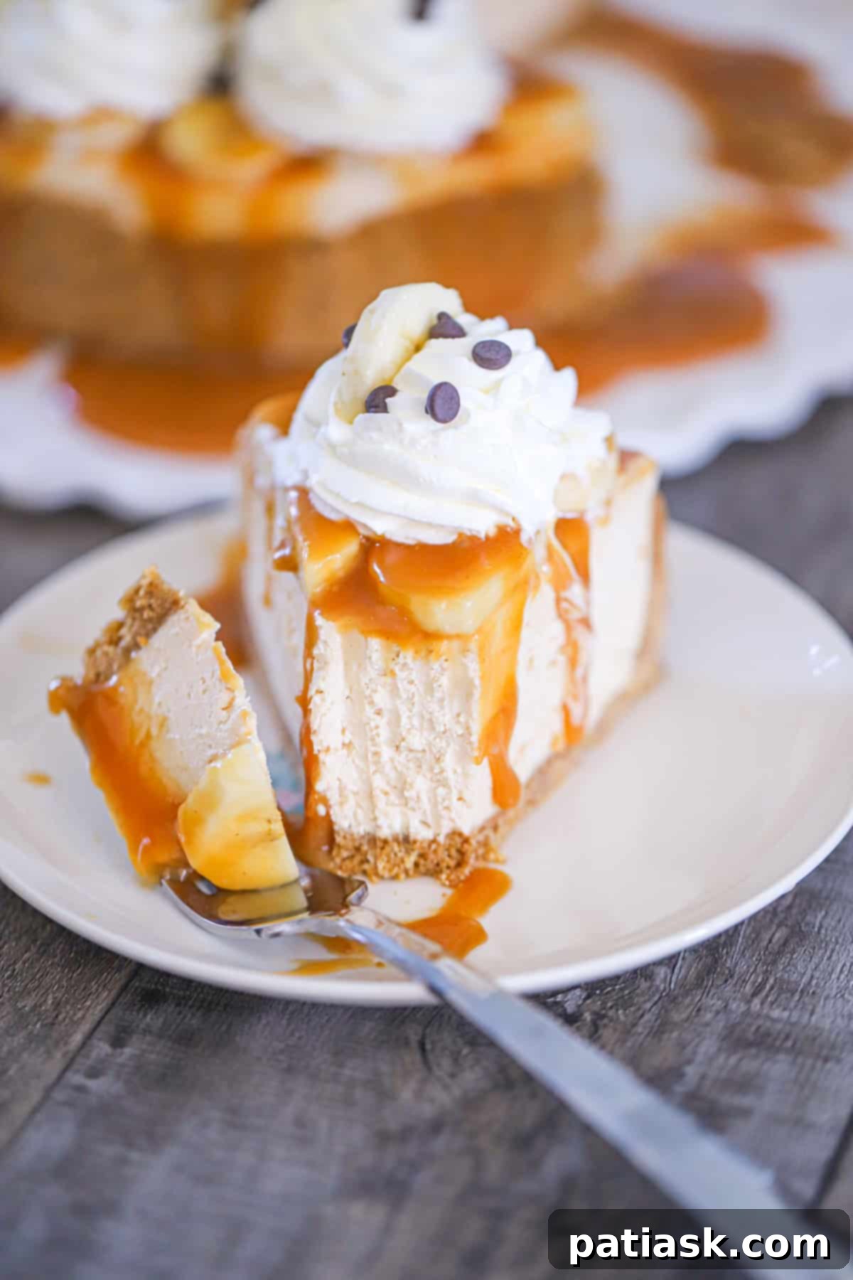 Luscious No-Bake Banoffee Peanut Butter Cheesecake 6 slice of decadent dessert with a generous topping of caramel, bananas, and whipped cream