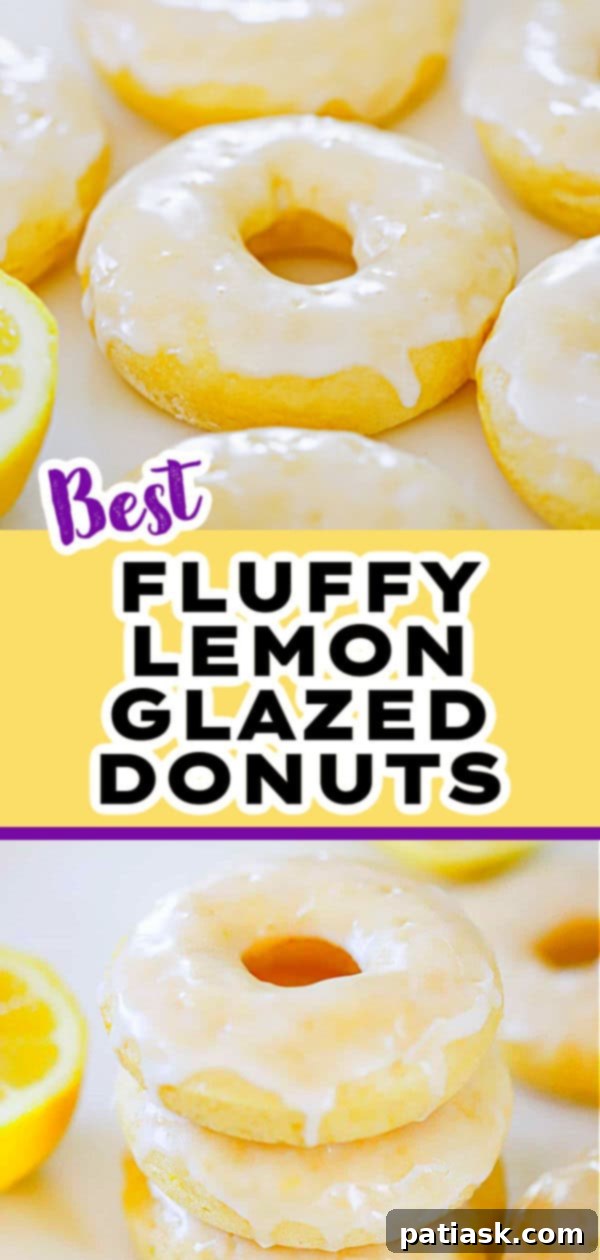 Lemon Zing Donuts 8 Two lemon glazed donuts on a white plate with a fork, ready to be eaten, showing a perfect, fluffy interior.