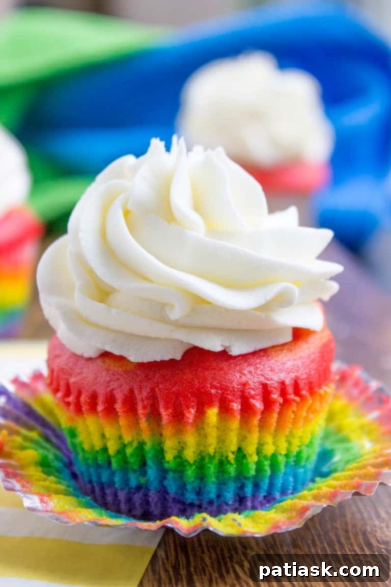 Rainbow cupcakes with fluffy vanilla cloud frosting