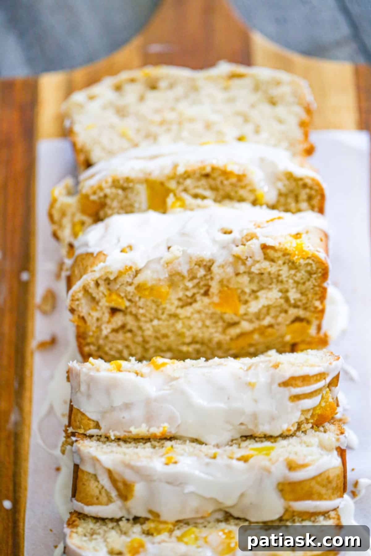 Easy Peach Cobbler Quick Bread 4 Beautifully glazed slices of homemade peach cobbler bread, a perfect summer dessert with fresh peach flavors.