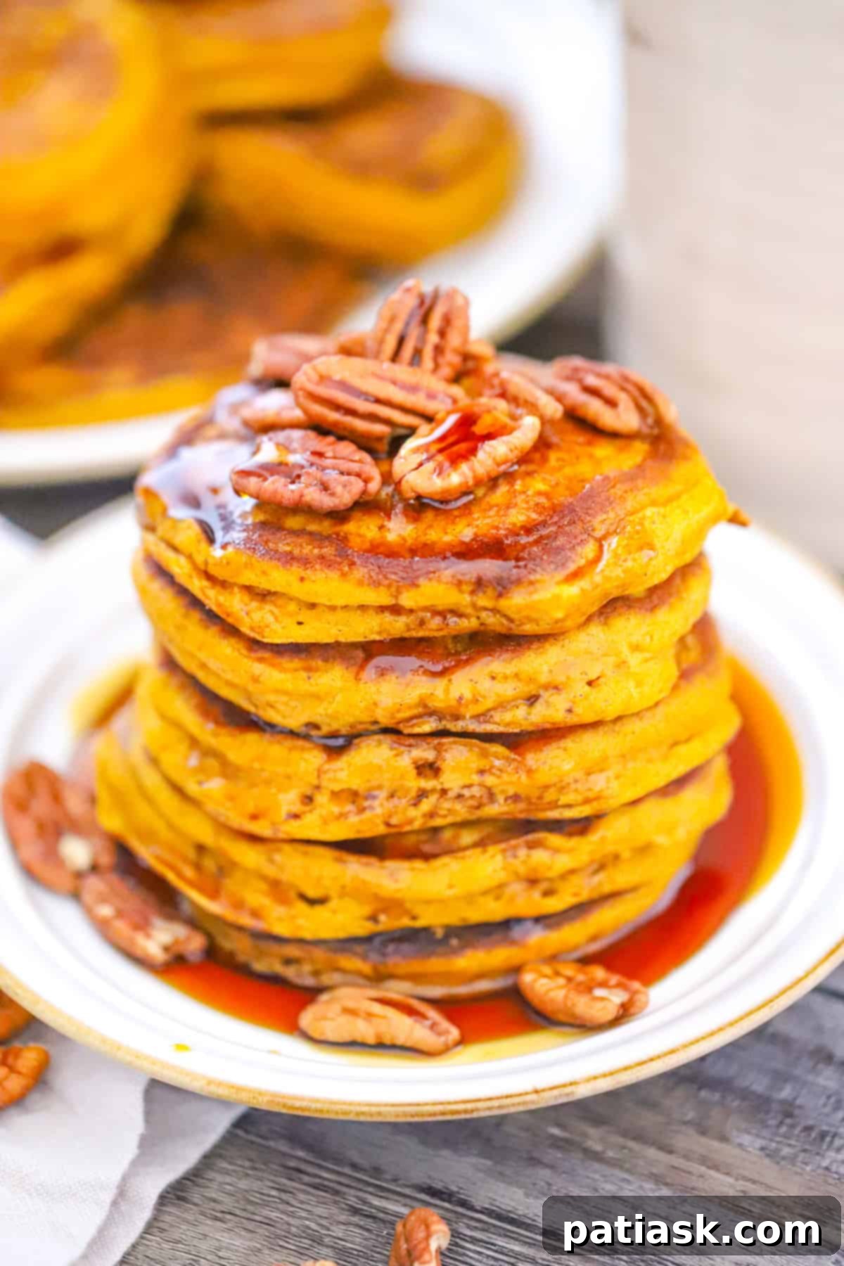 Extra Thick Pumpkin Pancakes 2 Best Super Light and Fluffy Pumpkin Pancakes recipe served with maple syrup and pecans