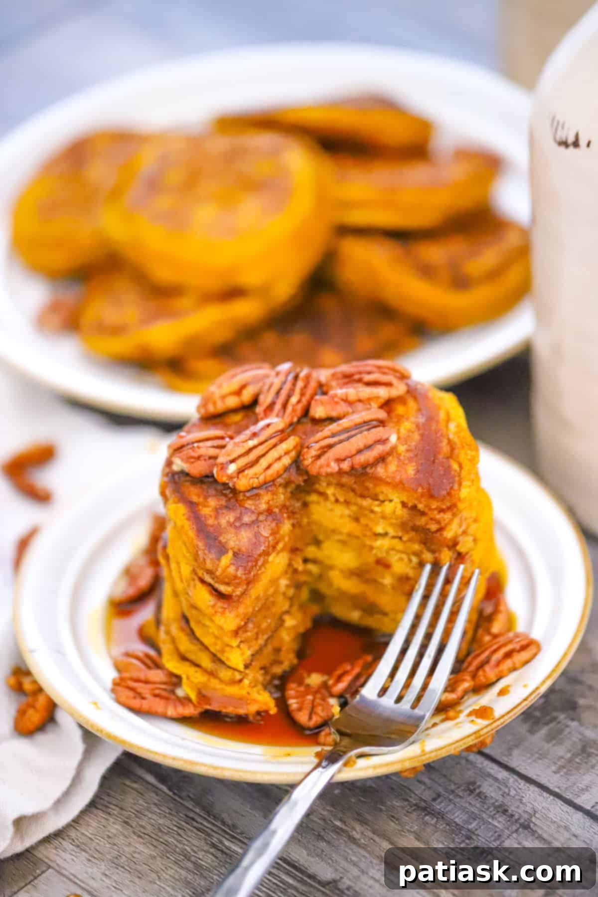 Extra Thick Pumpkin Pancakes 8 Close-up of Super Light and Fluffy Pumpkin Pancakes with whipped cream and a sprinkle of cinnamon