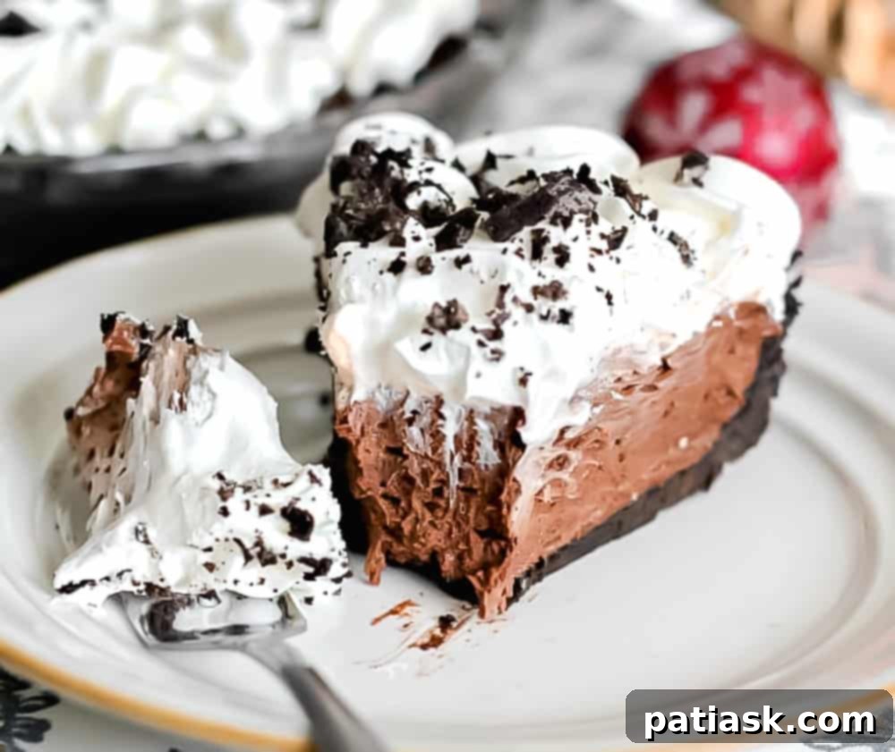 Decadent No-Bake Oreo Chocolate Cream Pie 3 No-bake chocolate cream pie with Oreo crust, topped with swirls of whipped cream and Oreo crumbles.