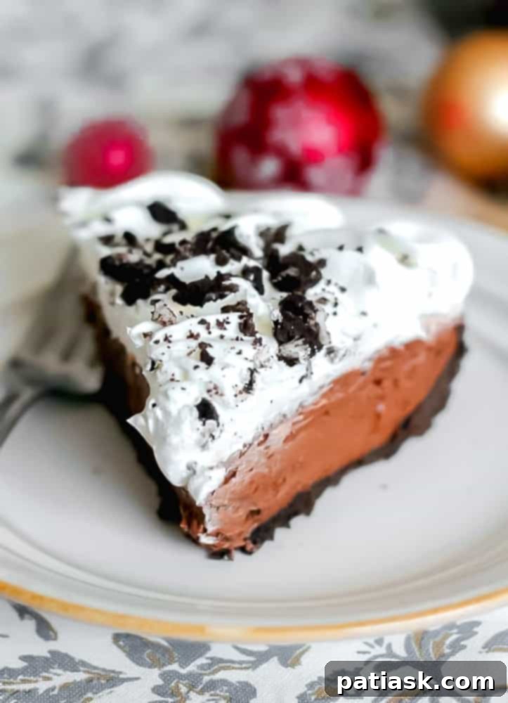 Decadent No-Bake Oreo Chocolate Cream Pie 6 A whole Easy Dreamy Oreo Chocolate Cream Pie, beautifully garnished and ready to be sliced.