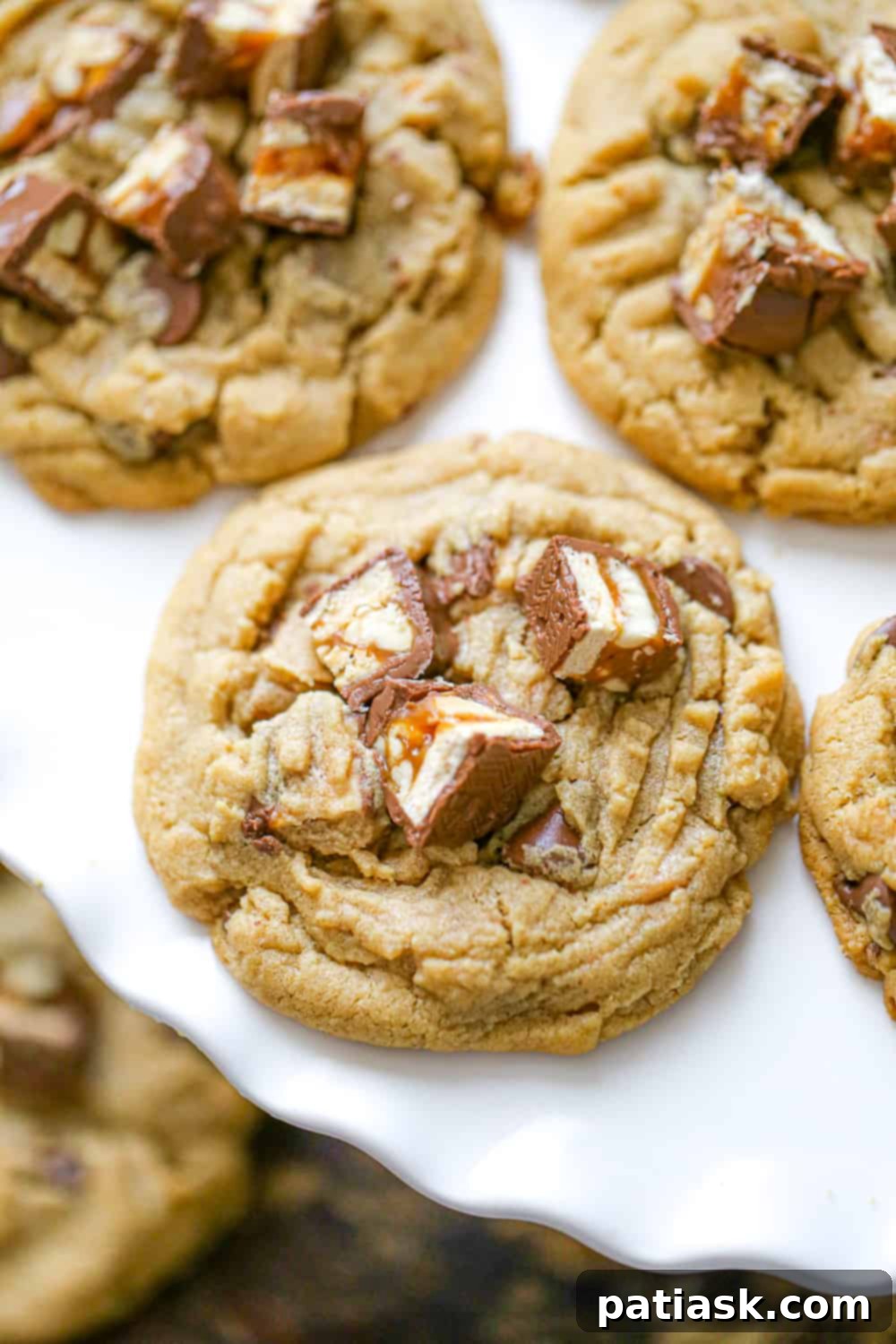 Sweet & Simple: 40 Easy Caramel Dessert Ideas 41 Snickers Peanut Butter Cookies with candy bars and chocolate chips