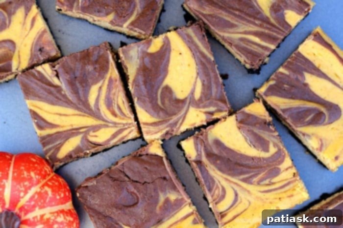 50 Effortless Pumpkin Delights 17 Pumpkin Chocolate Swirl Cheesecake Bars