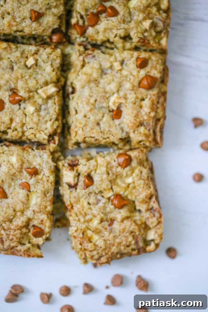 Freshly baked Apple Cinnamon Oatmeal Bars on a cooling rack