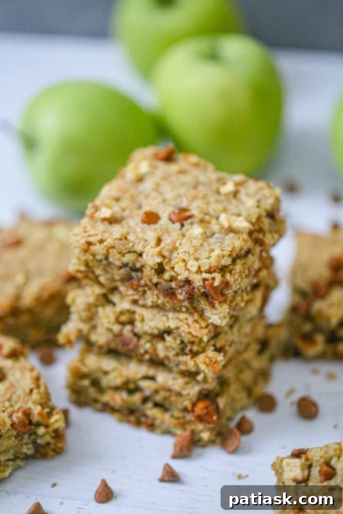A stack of golden brown Apple Cinnamon Oatmeal Bars