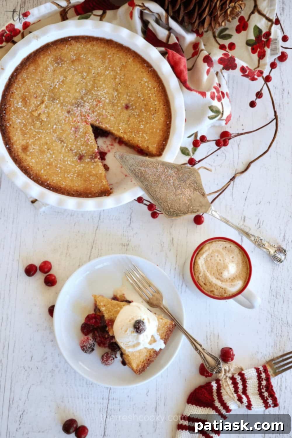 A rustic Cranberry Nantucket Pie, with a visible orange cranberry cookie crust and cranberries on top.