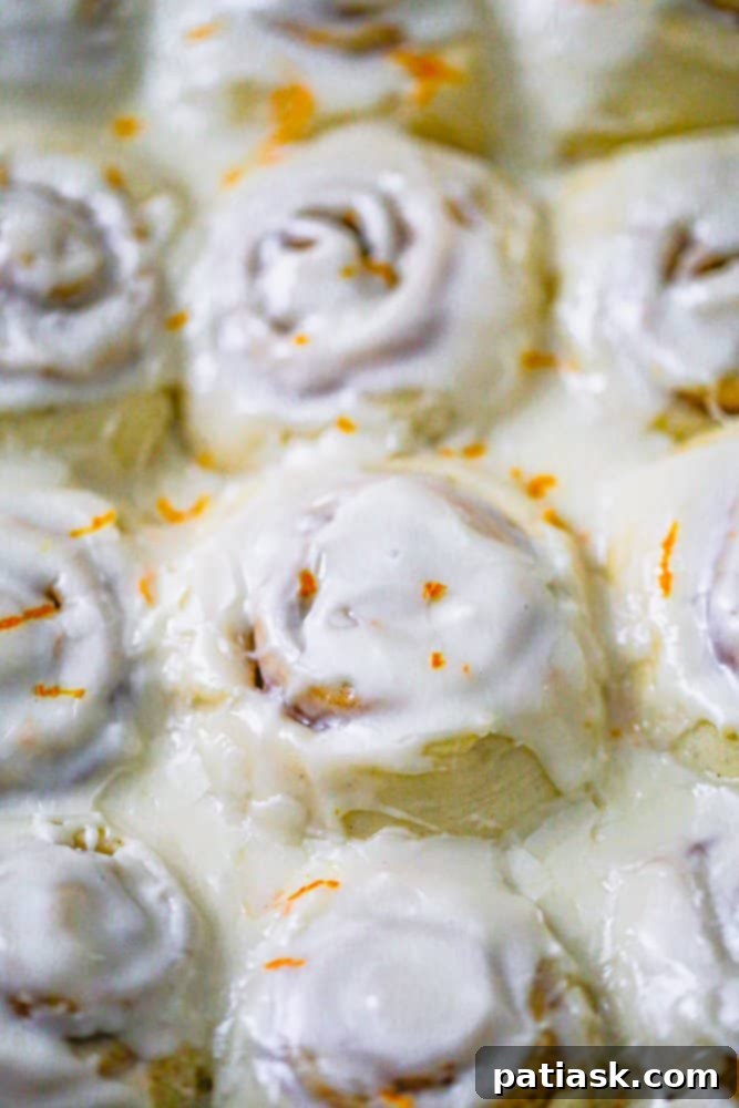 Easy Fluffy Orange Cream Iced Cinnamon Rolls recipe icing