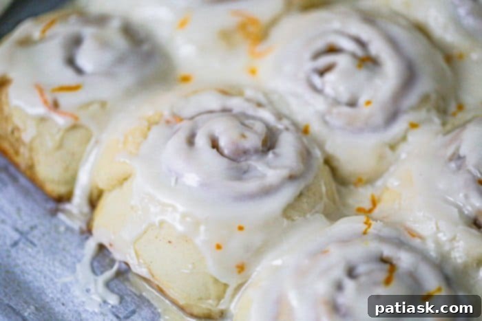 Easy Fluffy Orange Cream Iced Cinnamon Rolls recipe icing