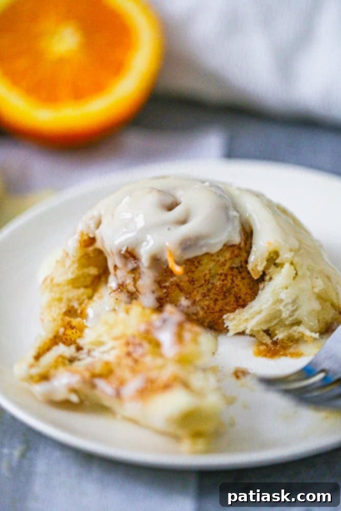 Easy Fluffy Orange Cream Iced Cinnamon Rolls recipe icing