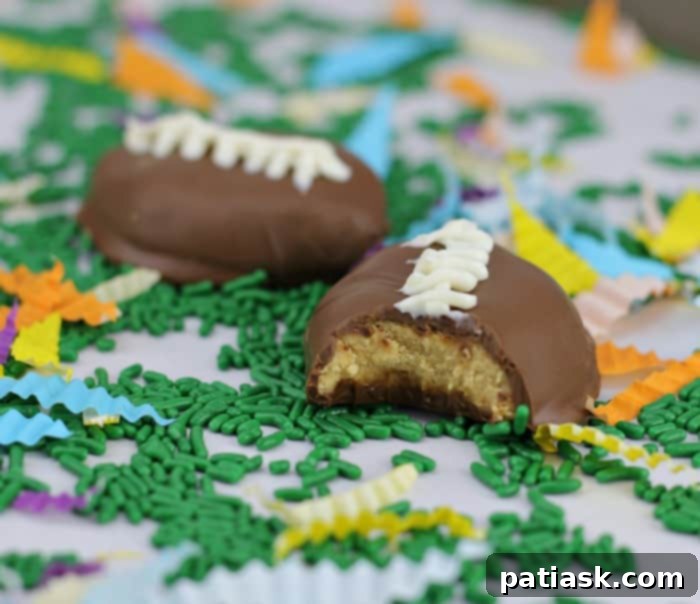 Touchdown Chocolate Peanut Butter Delights 4 Assorted Homemade Chocolate Peanut Butter Footballs on a plate, some with white icing laces, others plain, showcasing their tempting texture.