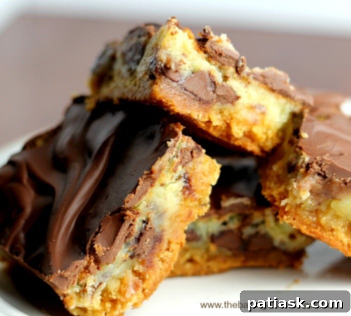 OMG chocolate chip gooey bars, loaded with chocolate chips and iced with more chocolate, a perfect score for game day.