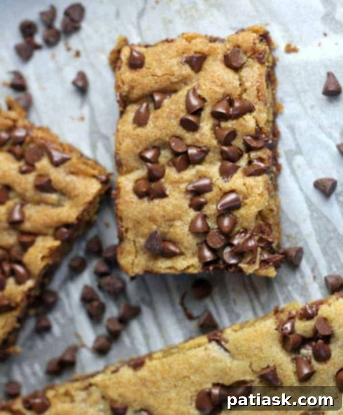 Sheet pan perfect chocolate chip cookie bars, buttery, chewy, and loaded with chocolate chips, ideal for feeding a crowd.