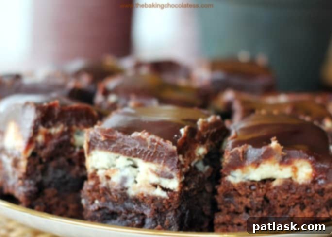 Cookie dough brownies with a rich brownie layer, cookie dough topping, and chocolate fudge ganache.