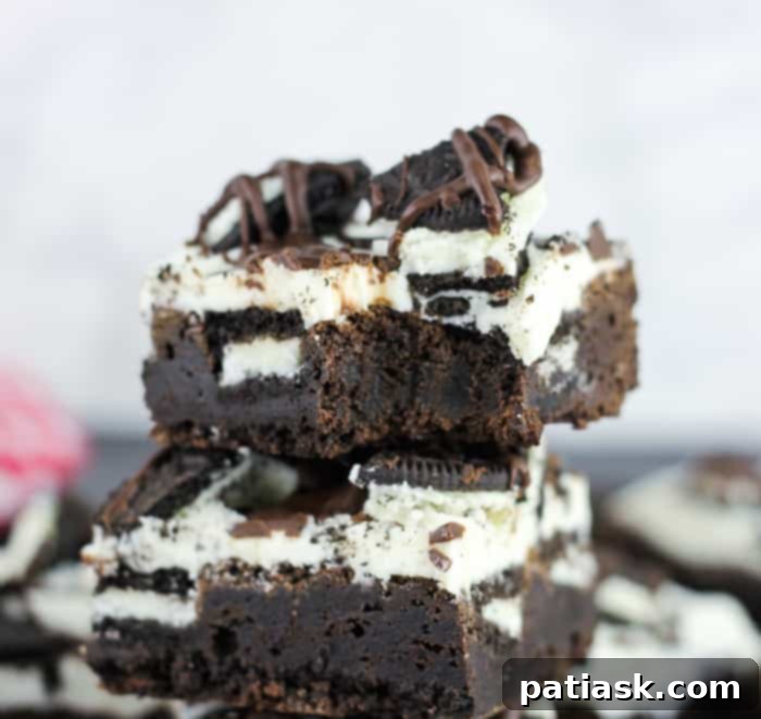 Decadent Oreo stuffed brownies topped with creamy Oreo vanilla frosting, ideal for chocolate and cookie lovers on game day.