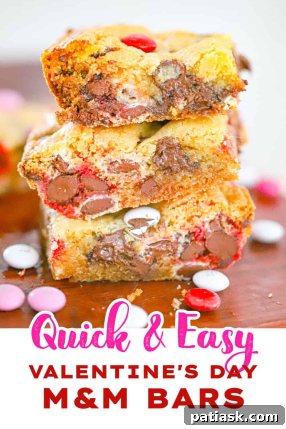 Fudgy Valentine M and M Bars 7 A close-up of a stack of Thick & Delish Valentine M&M Bars, showcasing their thick, chewy texture and abundance of colorful M&Ms.