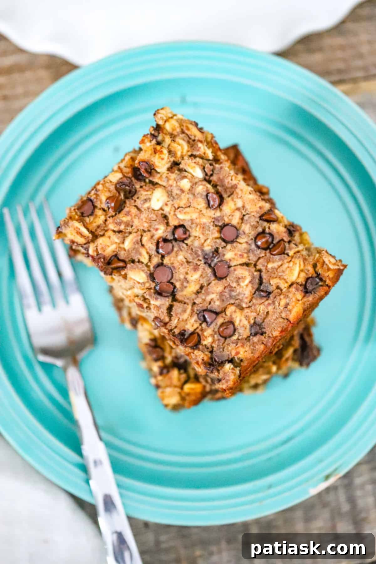 Wholesome Banana Chocolate Chip Baked Oats 3 Delicious and healthy baked oatmeal with banana and chocolate chips, perfect for a protein and fiber-rich breakfast