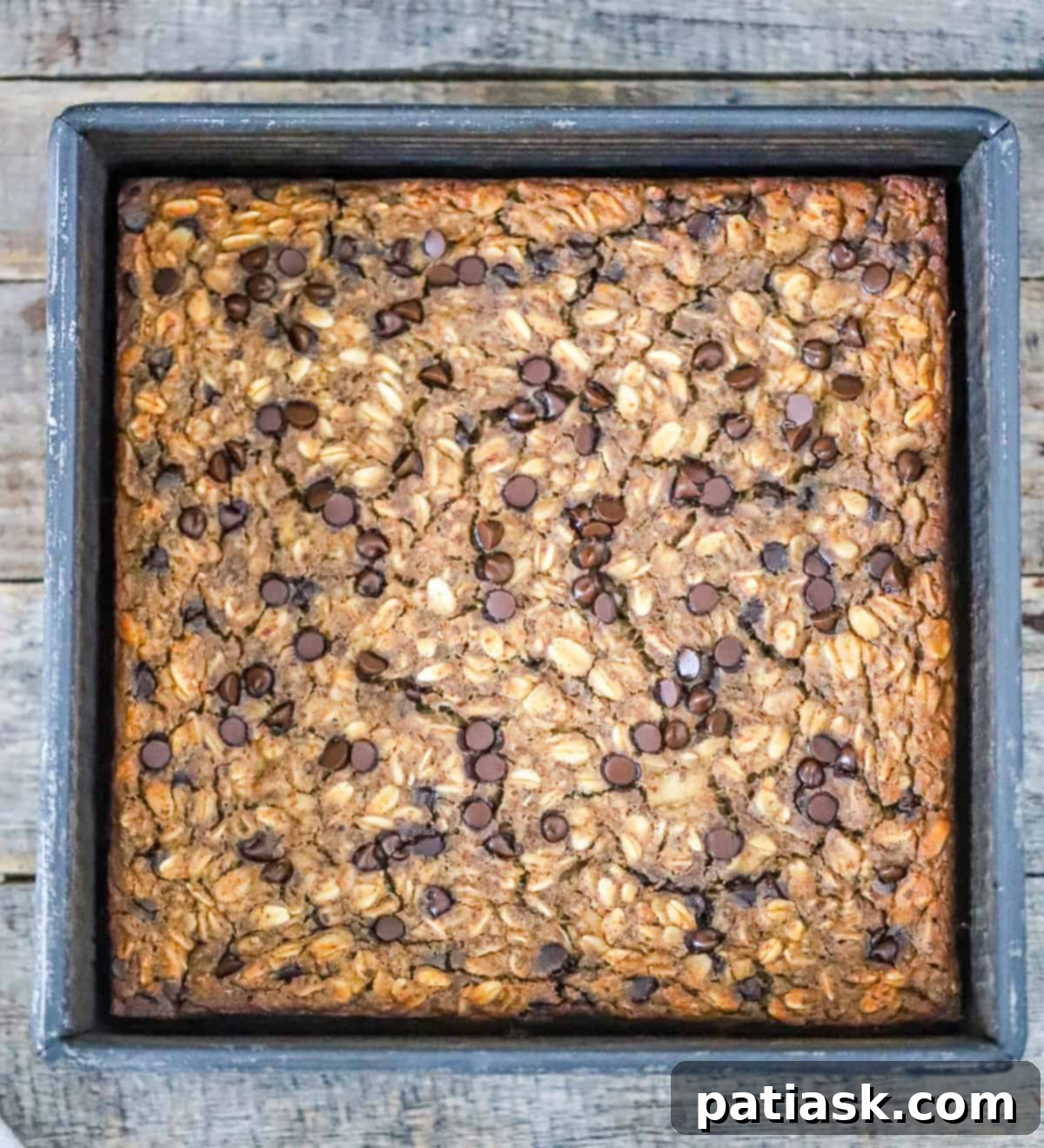 Wholesome Banana Chocolate Chip Baked Oats 4 Healthy breakfast bake with banana and chocolate chips in a baking dish