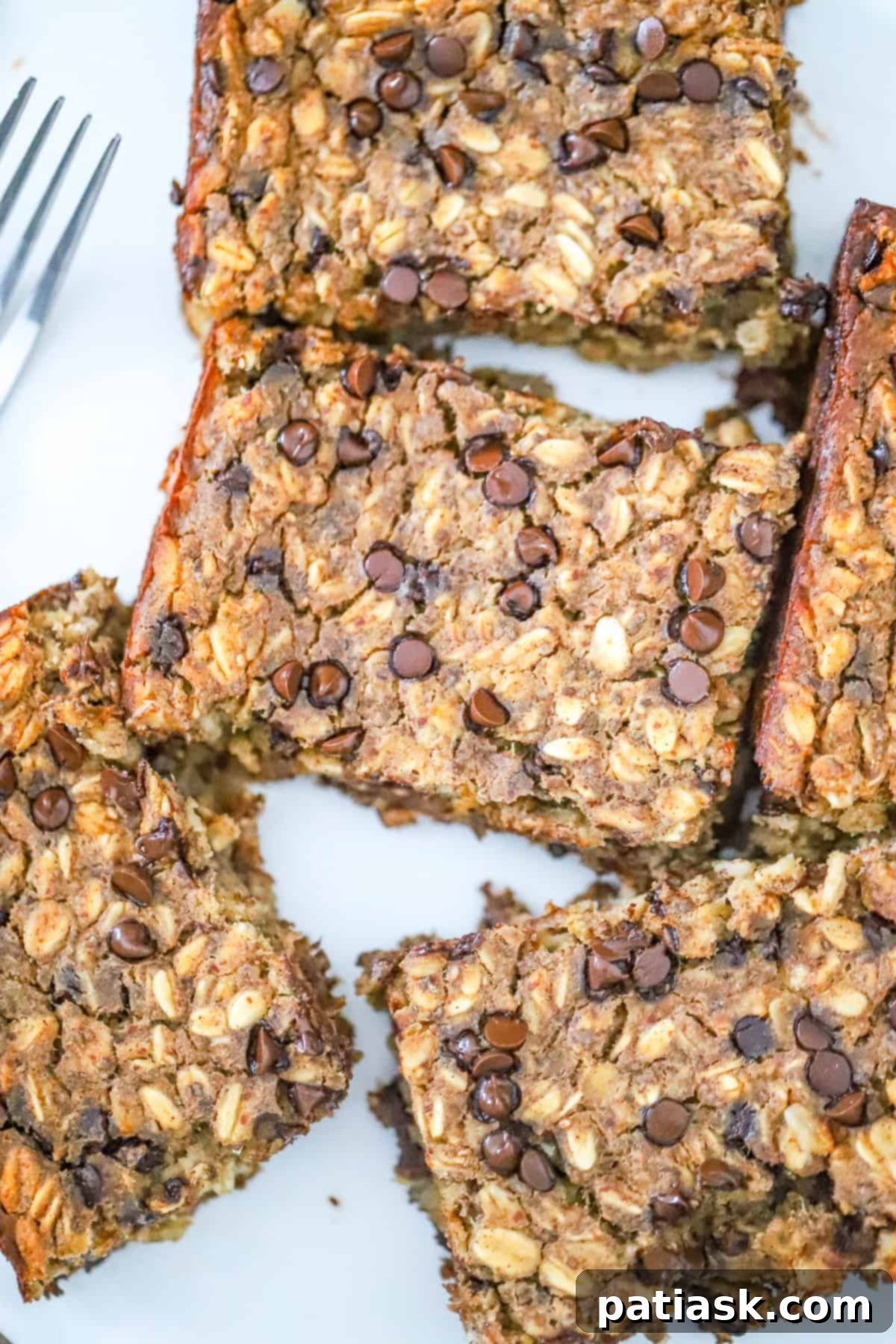 Wholesome Banana Chocolate Chip Baked Oats 6 Slices of healthy banana chocolate chip baked oatmeal ready to be served