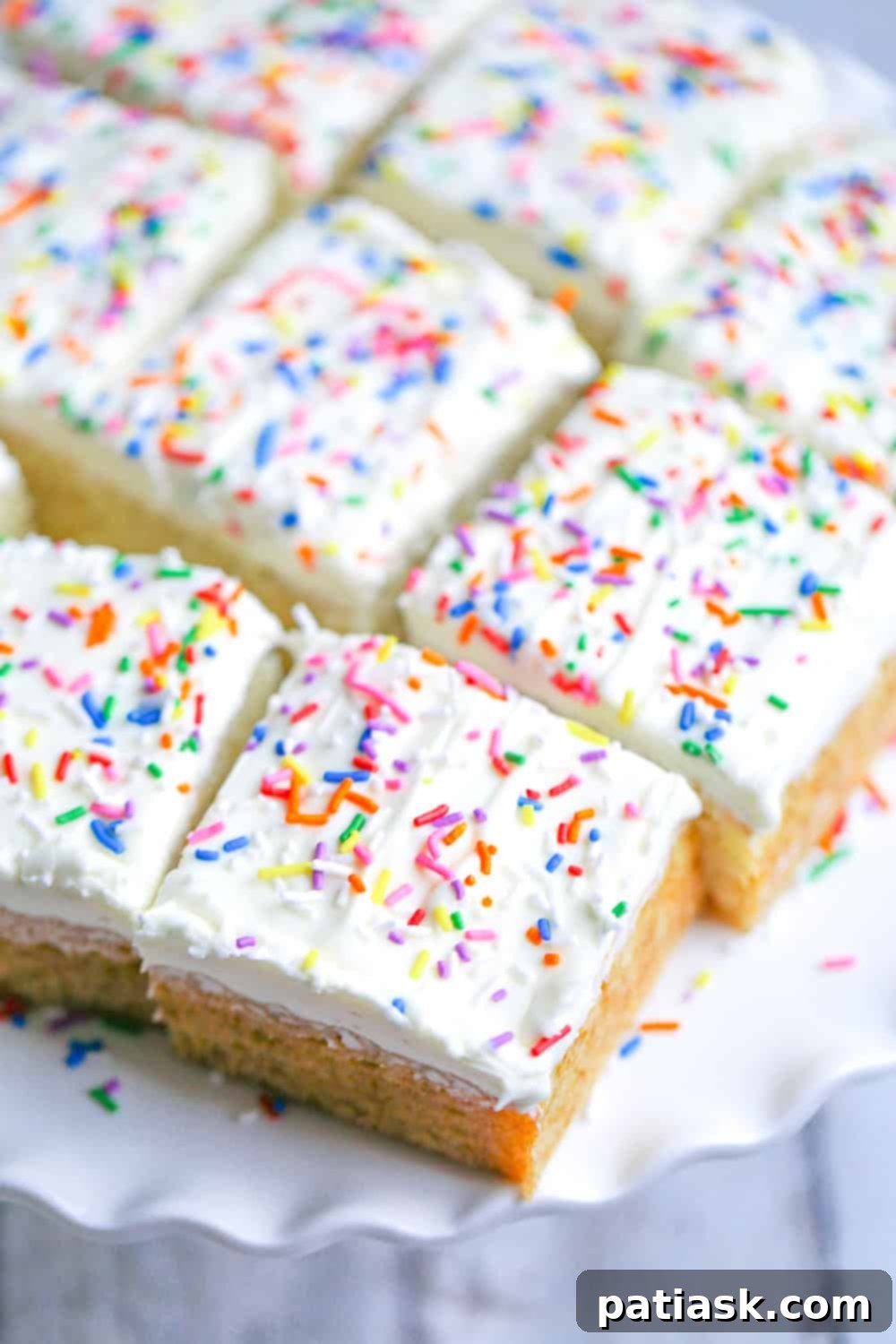 Zesty Lemon Cake 3 Closeup of the moist crumb of a slice of lemon snack cake, showing its tender texture.