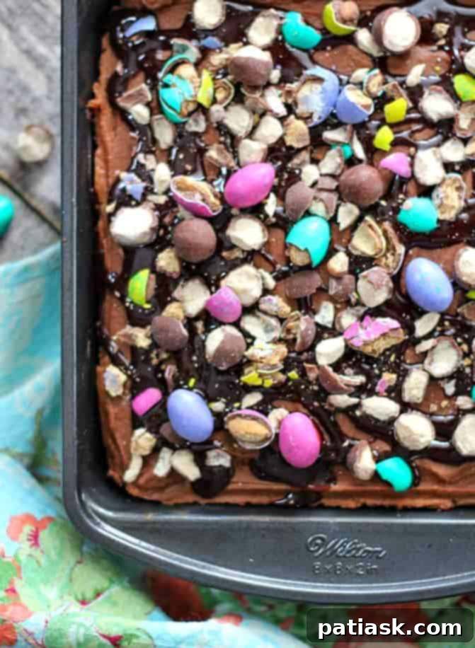 Ultimate Malted Peanut Butter Chocolate Poke Cake 3 Close-up view of a slice of Chocolate Peanut Butter Malt Poke Cake