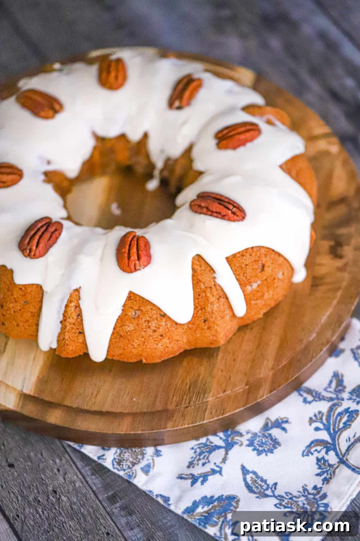 Apple Spice Bundt Cake with Vanilla Glaze, beautifully drizzled and ready to serve.