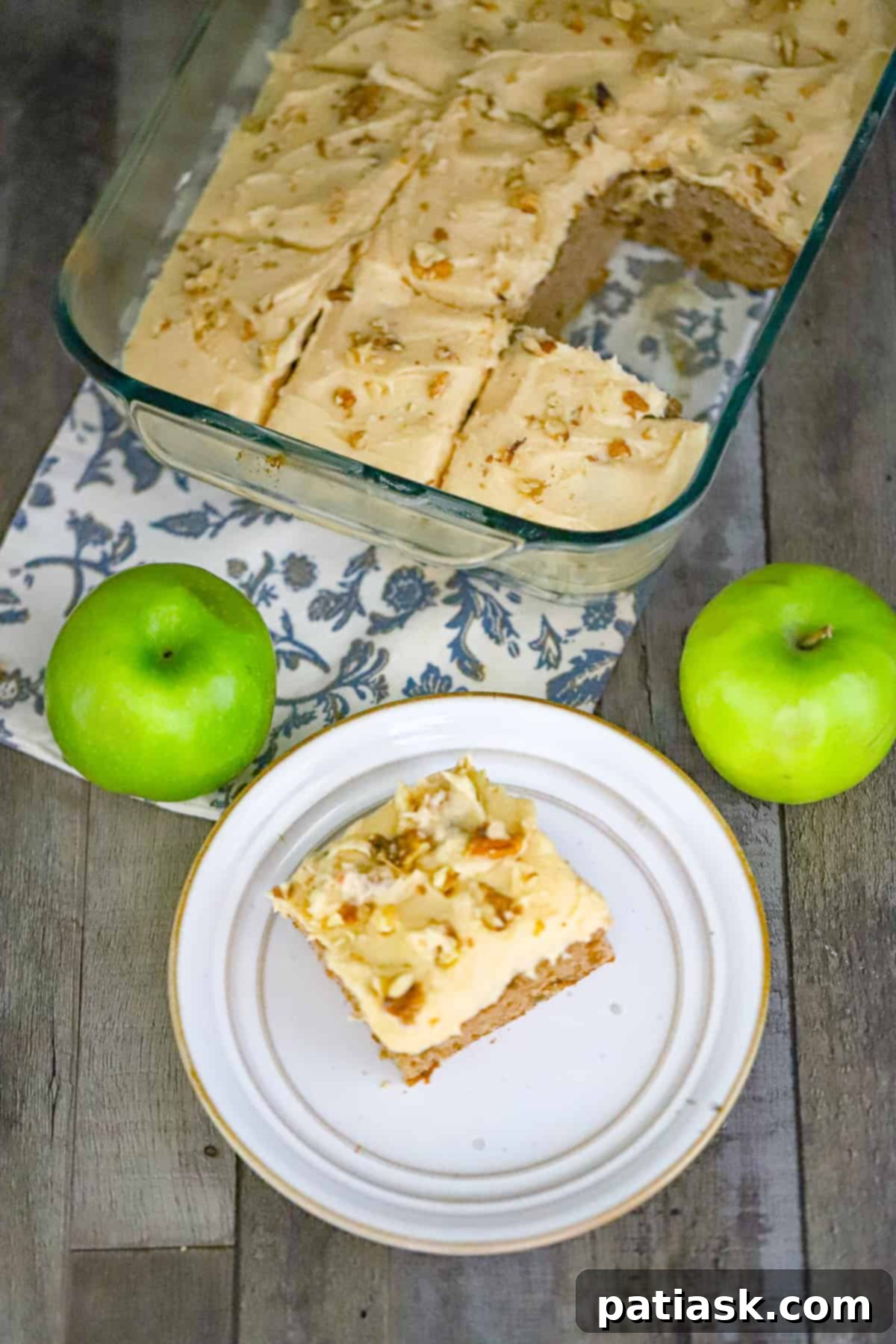 Autumn Apple Spice Cake with Creamy Caramel 3 Caramel frosted apple cake sliced for serving, showcasing the moist interior