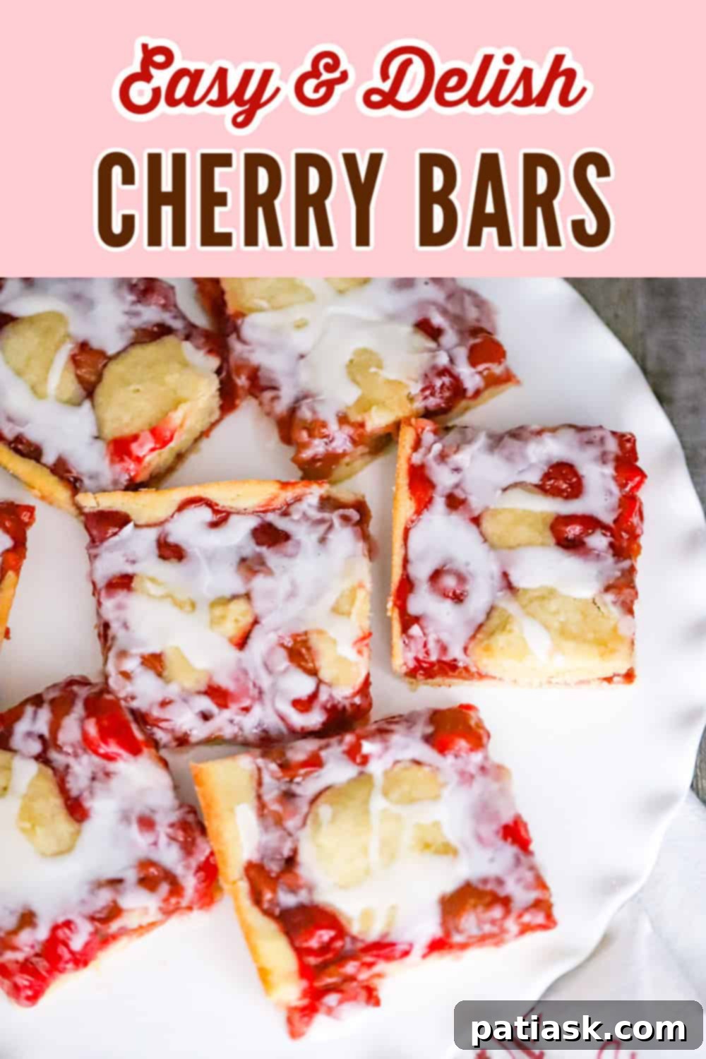 Cherry Cobbler Bars 12 Easy and delicious cherry bars on a wooden surface.