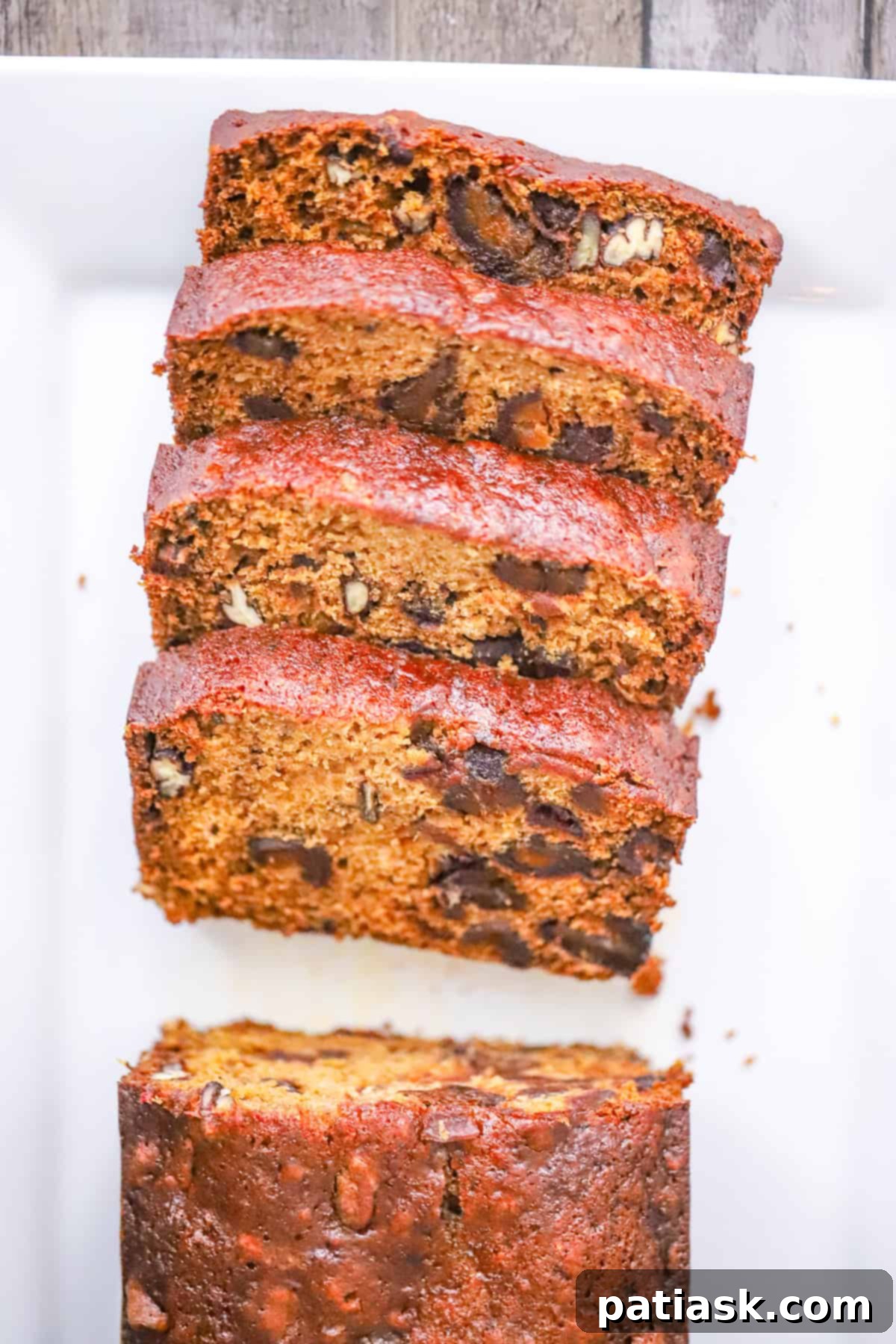 Grandma's Date Nut Bread 3 Full loaf of quick bread with dates and nuts, ready to be sliced