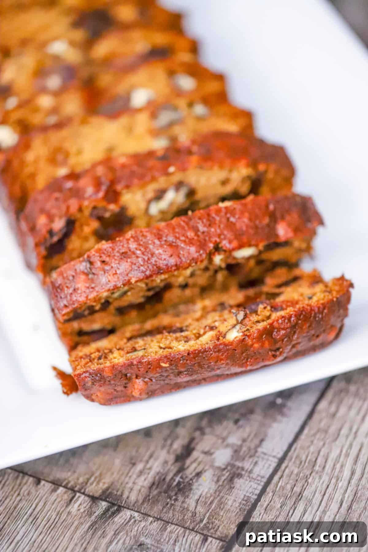 Grandma's Date Nut Bread 4 Freshly baked and sliced loaf of homemade date nut bread, showing the interior texture