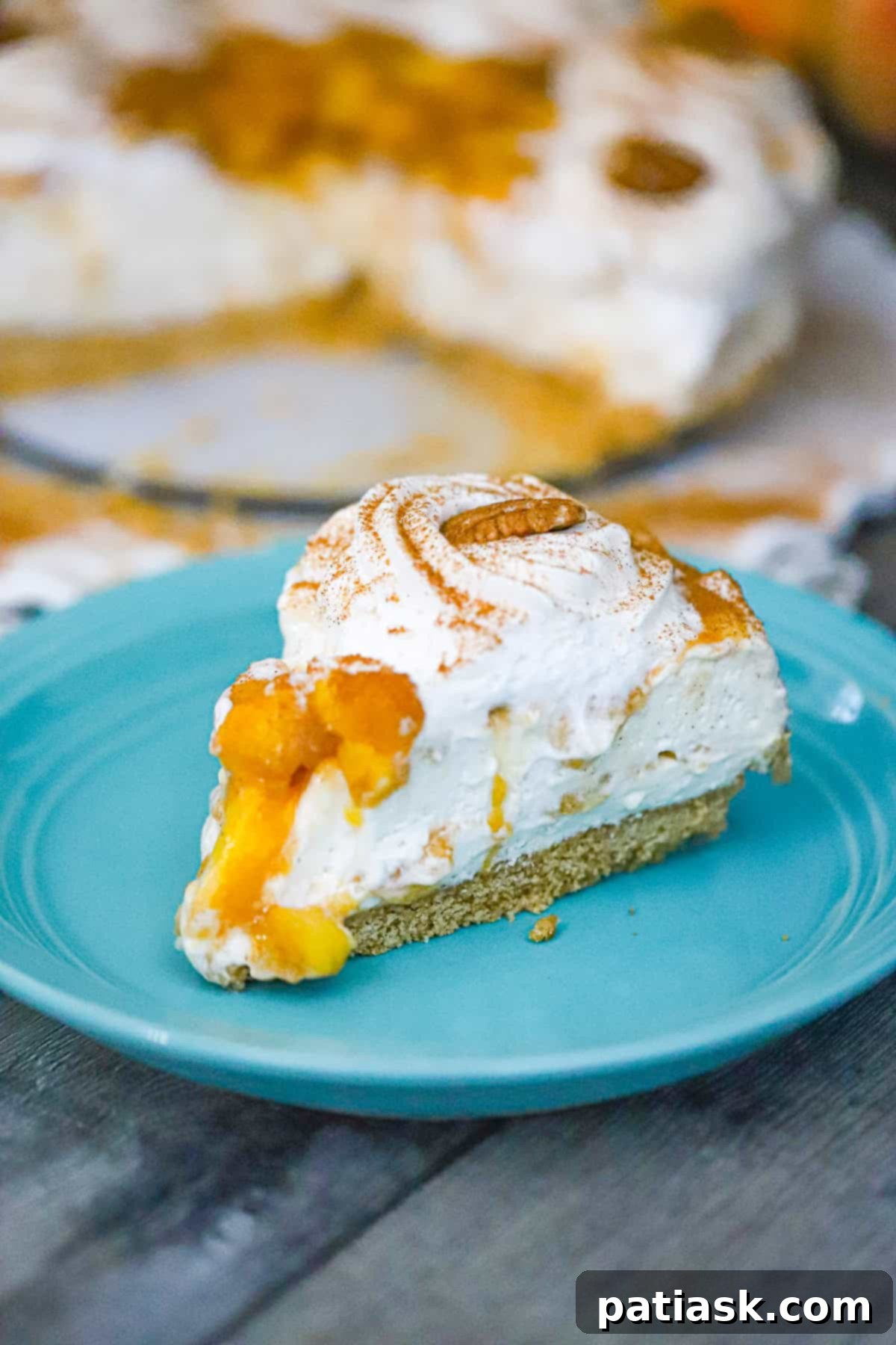 No-Bake Caramel Peach Cheesecake Delight 7 Fully set caramel peach cheesecake with whipped cream and peach slices, ready to serve