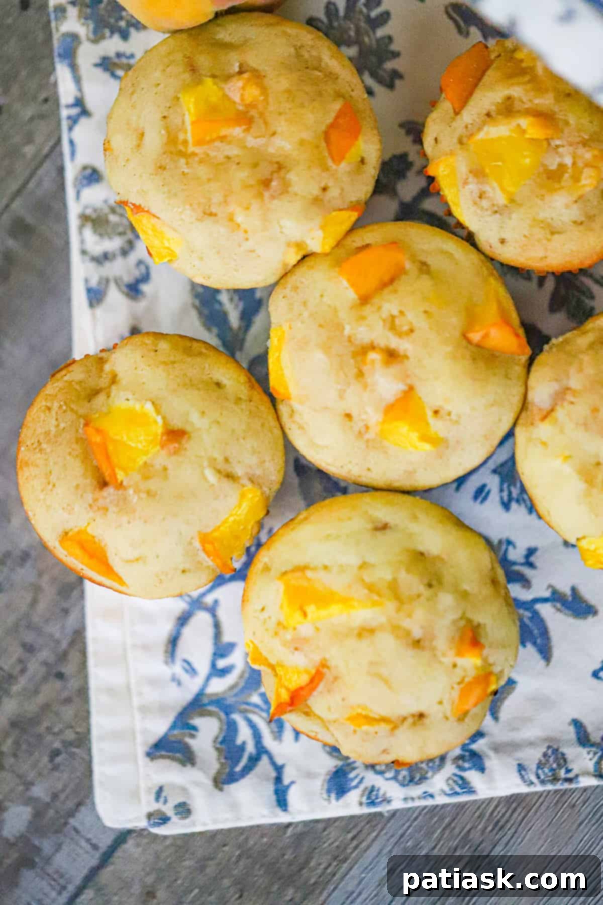 Juicy Peach Muffins with Optional Streusel 4 Mixing bowl with muffin batter and chopped peaches gently folded in