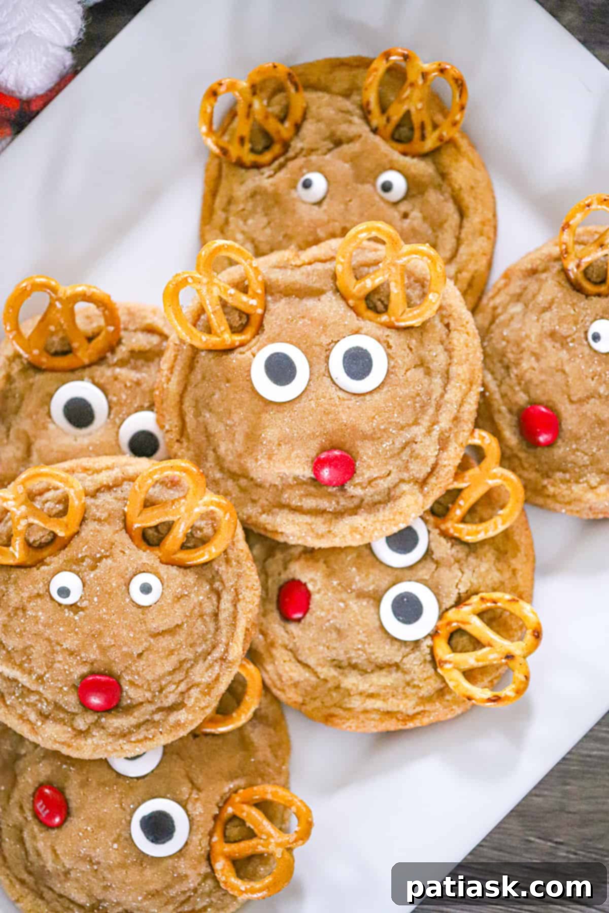 Festive Reindeer Delights 3 Close-up of a batch of freshly baked Reindeer Christmas Cookies ready for holiday festivities.